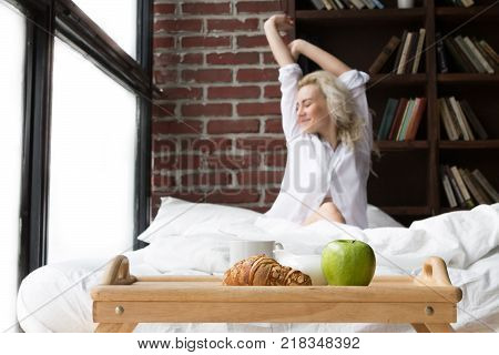 Single Pretty Woman in Bed with Breakfast