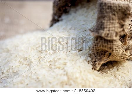 Raw Organic Rice,oryza Sativa, Coming Out From A Gunny Bag.