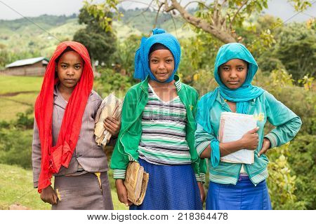 ADDIS ABABA, ETHIOPIA - MAY 4, 2015 : Young ethiopian schoolgirls holding their exercise books.