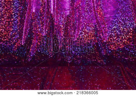 multicolored shimmering, dark, crimson red rainbow background