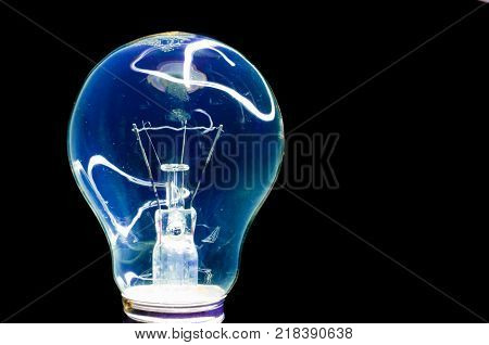 Abstract light bulb isolated on black background