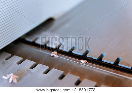 Pine wood chip on the jointer blade in the small workshop