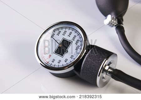 Black tonometer. Blood pressure meter medical equipment sphygmomanometer isolated on white, close-up. Health care and medicine concept.