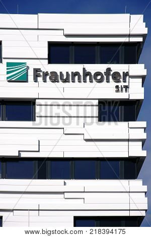 DARMSTADT, GERMANY - OCTOBER 31: The logo of the Fraunhofer Institute for Technical University Darmstadt on the facade of a modern building on October 31, 2017 in Darmstadt.