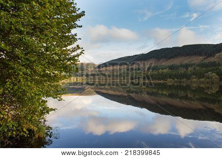 Morning valley reflections at Pontsticill reservoir Brecon Beacons South Wales