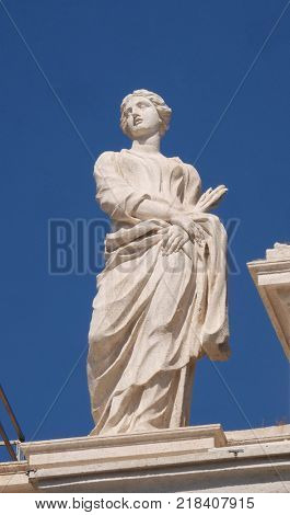 ROME, ITALY - SEPTEMBER 02: St. Thecla, fragment of colonnade of St. Peters Basilica. Papal Basilica of St. Peter in Vatican is the center of Christianity in Rome, Italy on September 02, 2016.