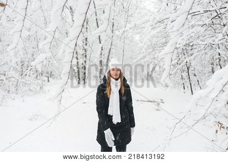 Beautiful Young Girl In A White Winter Forest