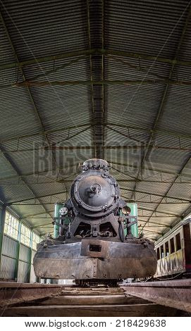 Front View of an Old Steam Locomotive Standing in the Depo