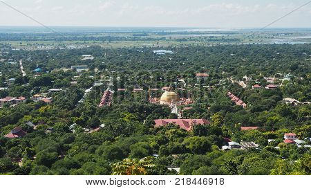 High angle view of multiple temples and pagodas on the mountains with Irrawaddy river in the background from sagaing hill, Sagaing region of Myanmar.