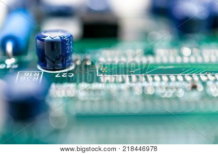 Computer parts close up macro shot on green board.