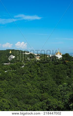 High angle view of multiple temples and pagodas on the mountains with Irrawaddy river in the background from sagaing hill, Sagaing region of Myanmar.