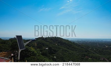 High angle view of multiple temples and pagodas on the mountains with Irrawaddy river in the background from sagaing hill, Sagaing region of Myanmar