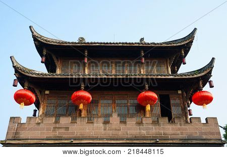 Low angle view on the ancient Chinese architecture with red lantern