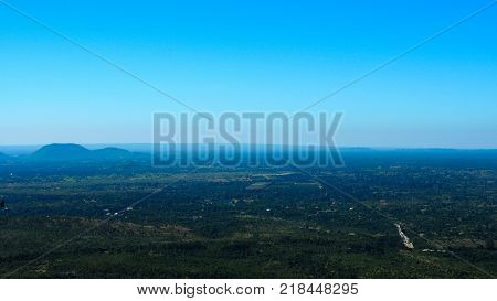 High angle view of multiple temples and pagodas on the Mt. Popa - holy mountain for burmese people with lots of temples on the top. Located in southeast of Bagan Myanmar (Burma).