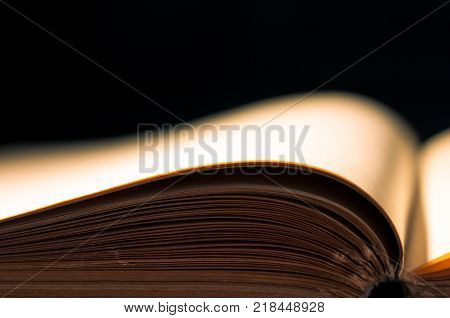 Empty book page isolated on black background