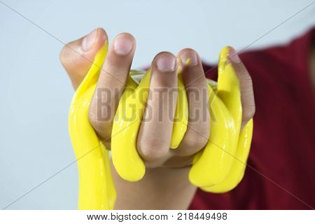 Kid Playing Hand Made Toy Called Slime Selective focus on Slime