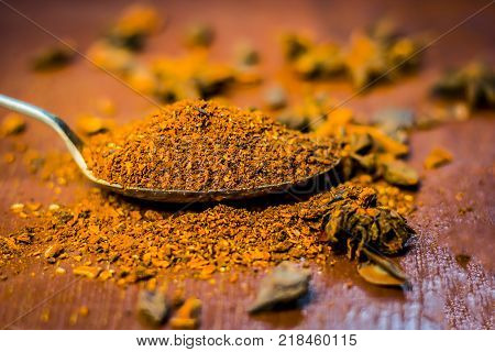 Close Up Star Aniseed,illicium Verum Powder In A Antique Spoon.