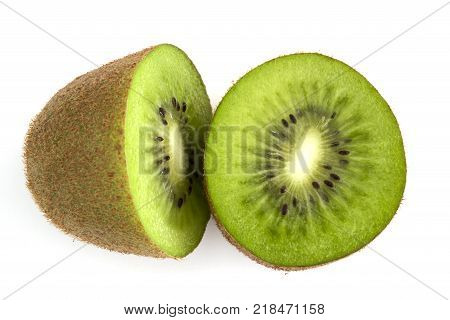 Single whole Kiwi fruit cut in half isolated on white background