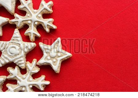 Christmas pastries the gingerbread cookie in the shape of stars and snowflakes food isolated on red background