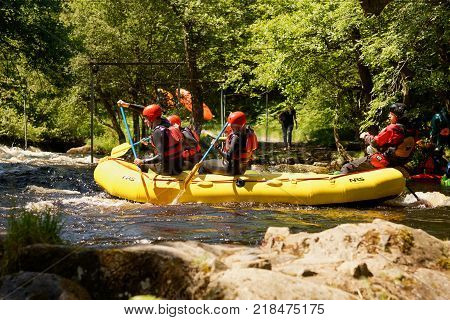 Bala Wales United Kingdom - June 18 2017: White water rafters shooting the rapids at the National White Water Centre on the River Tryweryn in the Snowdonia National Park