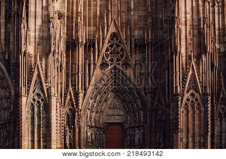Architectural fragment of central entrance of the Strasbourg cathedral. Gothic decorative elements on Roman Catholic Cathedral. Alsace, France.