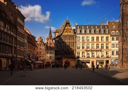 STRASBOURG, FRANCE - JANUARY 5, 2017: Cathedral Square in old sity. View of traditional half - timbered house Kammerzell - most famous secular building in Strasbourg . Alsace, France.