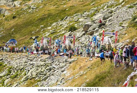 Col de la Croix de Fer France - 25 July 2015: Spectators during the passing of the Publicity Caravan on the roadside to the Col de la Croix de Fer in Alps during the stage 20 of Le Tour de France 2015.