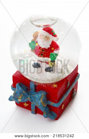 Waterglobe. Christmas waterglobe with Santa Claus. Christmas decoration glass ball water ball globe with snow and Santa Claus. Christmas decoration on white background.