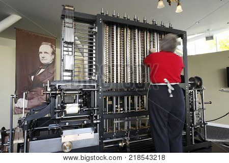 Mountain View City, USA - Nov 24, 2008: A engineer is operating the Difference Engine of 19th century in the Computer history Museum in Mountain View City, USA, on Nov 24, 2008.