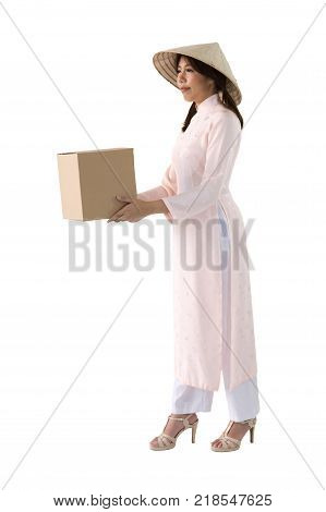 beautiful woman in pink dress and vietnam hat holding box. isolated background with clipping path.