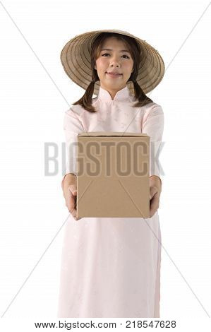 beautiful woman in pink dress and vietnam hat holding box. isolated background with clipping path.
