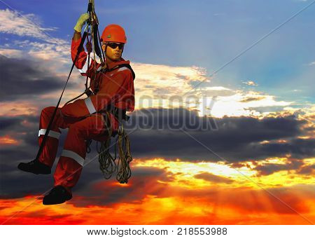 Mannequin in overalls steeplejack on cloudy sky background