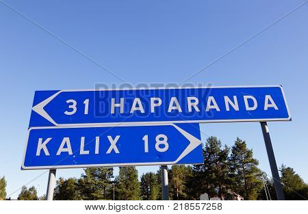 Signpost with dirction to the two Swedish cities Haparanda and Kalix.