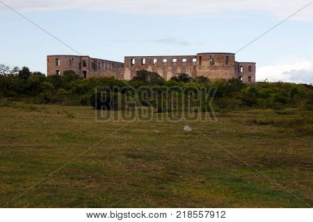 A distant view of Borgholm Castle ruins located near the town Borgholm in the Swedish province of Oland.