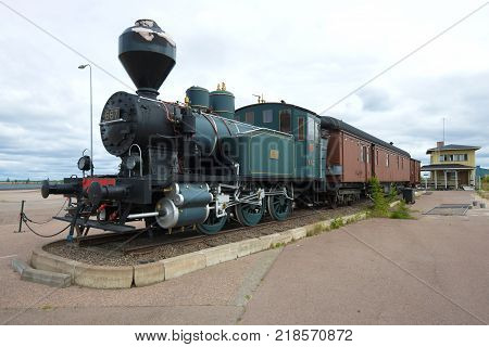 KOTKA, FINLAND - JUNE 03, 2017: Old steam locomotive Vr1 (before 1942 - L1 nickname - Chicken) with wagons in the sea center of Vellamo cloudy day