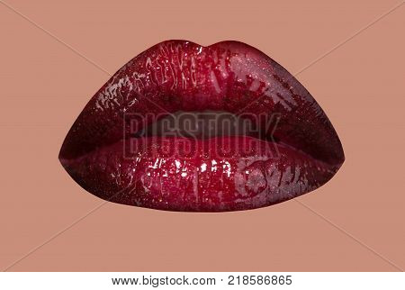Sensual lips mouth lipstick open isolated on pink background. Female kiss with brilliance gloss. Lip gloss glamour lipstick and make-up cosmetics. Red luxury lips with sparkles