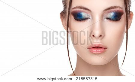 Half-face portrait of sensitive woman with perfect fresh clean skin wet effect on her face and body high fashion and beauty portrait creative makeup theme strobing or highlighting makeup