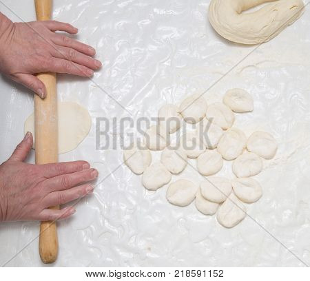 chef rolls the dough . Photos in the studio