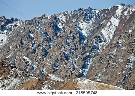 Open rocks on the mountain side in the Tian-Shan. Rocky with outcrops talus cliffs in Kyrgyzstan.