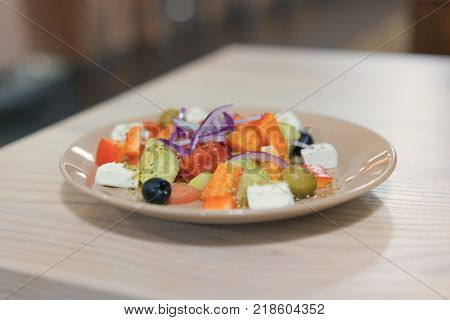 vegetable salad with cheese, cabbage, pepper, tomato and cucumber. with copy space. top view.