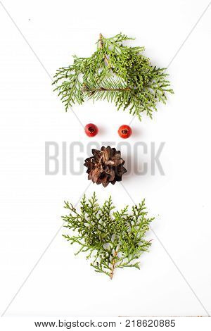 Gnome or elf face from natural materials. Christmas silhouette picture in minimalistic design concept