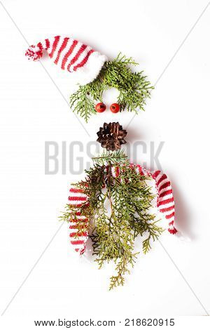 Gnome or elf face from natural materials. Christmas silhouette picture in minimalistic design concept