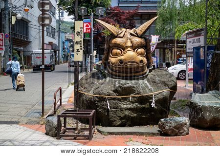 Nagano - Japan, June 5, 2017: Sculpture of the furious, frenzied lion, Kioi Jishi, at Akiba Shrine in Nagano. This lion like figure drives away ill fortune.