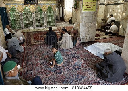 Yazd Iran - April 21 2017: Shrine of Prince Fazel Prayer hall of Sahhzade Fazel Holy Shrine muslims pray.