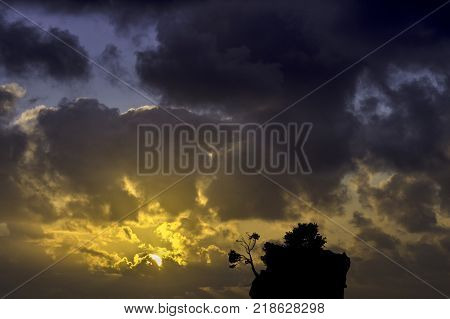 Dramatic sunrise over the Adriatic Sea with Kamen Brela - Tiny famous island in Brela, Makarska Riviera, Croatia