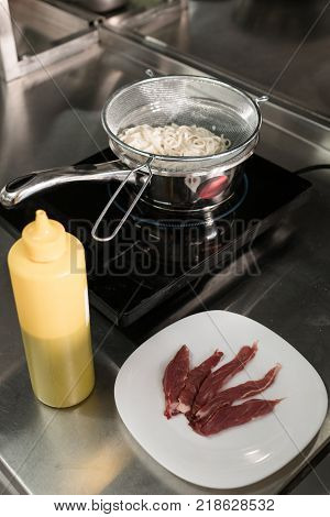 Restaurant routine - meal is cooking on the stove. Delicious food ingredients to satisfy any gourmand