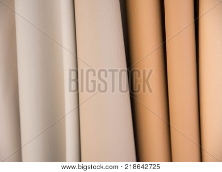 Color palette sample of leather material as a background.