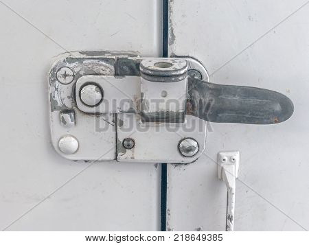 close up of old door lock of truck container