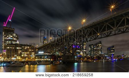 Vancouver Canada - December 15, 2017: Granville bridge and Vancouver Downtown at night time view from Granville Island