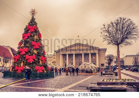 Vilnius, Lithuania: Christmas tree and decorations in Town Hall Square at sunset